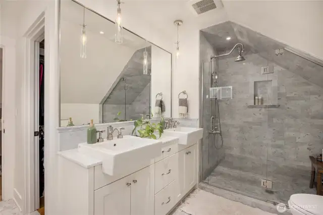 Primary bath with double sinks, in-floor programmable heating, and gorgeous marble throughout!