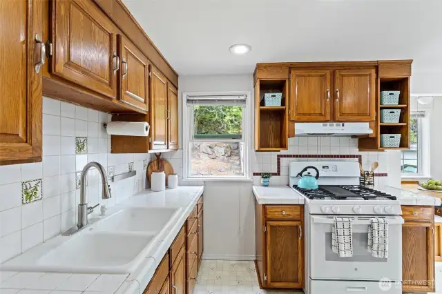 The functional and large kitchen looks out onto the backyard with easy access to the outside.