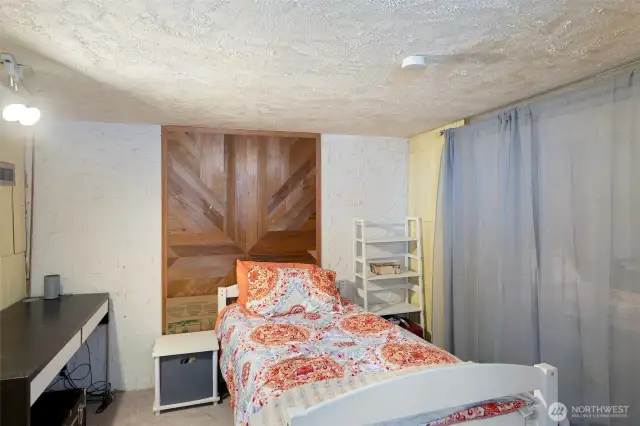 Lower-Level non-conforming 3rd bedroom with wall-to-wall carpeting, great office space.