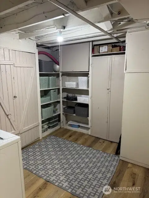 Lower level utility room with tons of storage space.