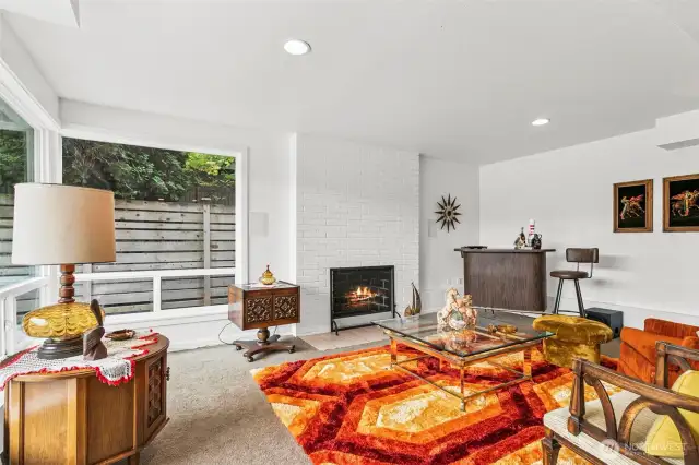 Downstairs living room is HUGE with wood burning fireplace
