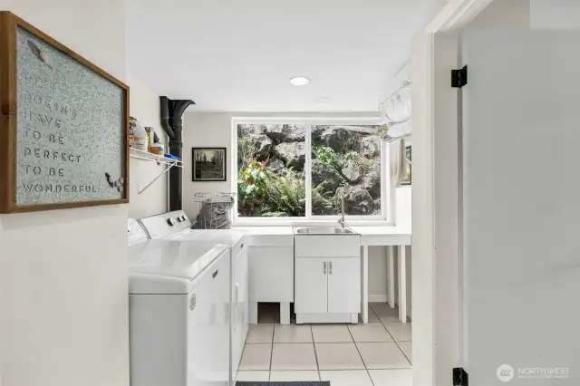 Laundry room downstairs -- has refrigerator and large sink.   Add a stove and the downstairs could be a full MIL.