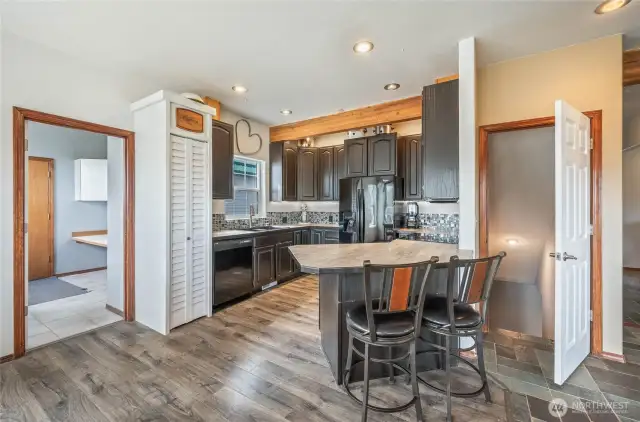kitchen with stairs down to basement.