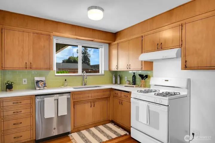 Kitchen updates include quartz counters and a tile backsplash