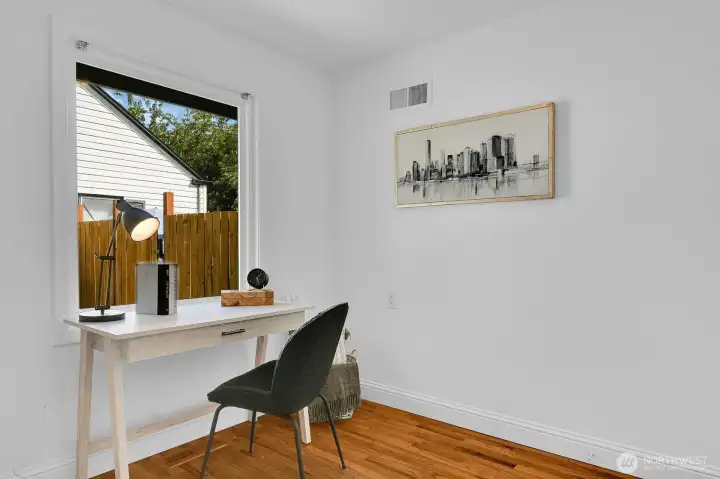 Den/office adjacent to living room and kitchen
