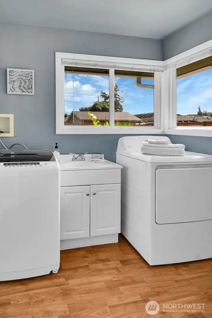 Utility room with half bathroom