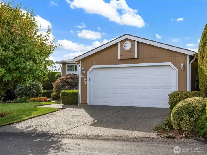 Lot's of space to park and the spacious two-car garage holds not only your two cars but your tools and all.