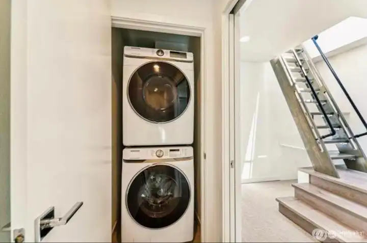 Stackable Wash/Dryer next to master bedroom.