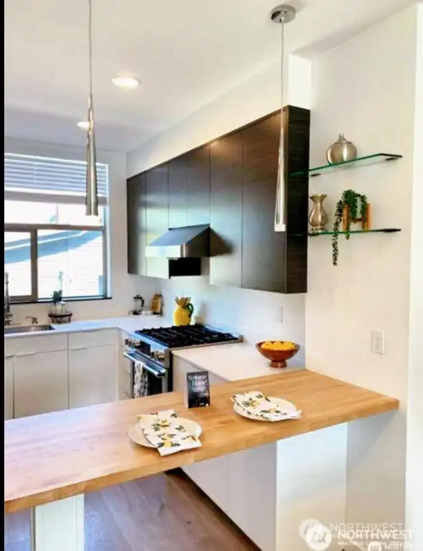 Stainless steel appliances and modern stye.