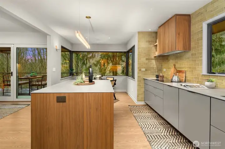 The kitchen offers picturesque views and a cozy breakfast nook.