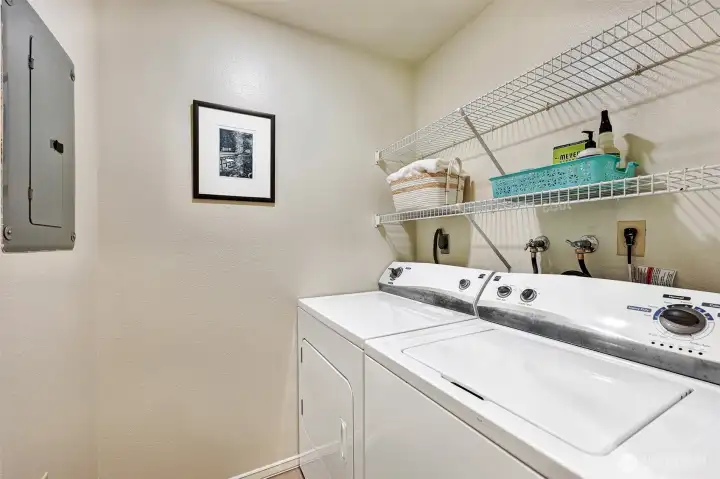 Laundry room with full-size washer and dryer. New flooring.