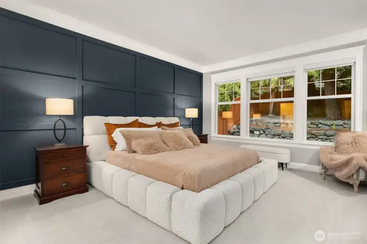 Primary suite with stylish accent wall.