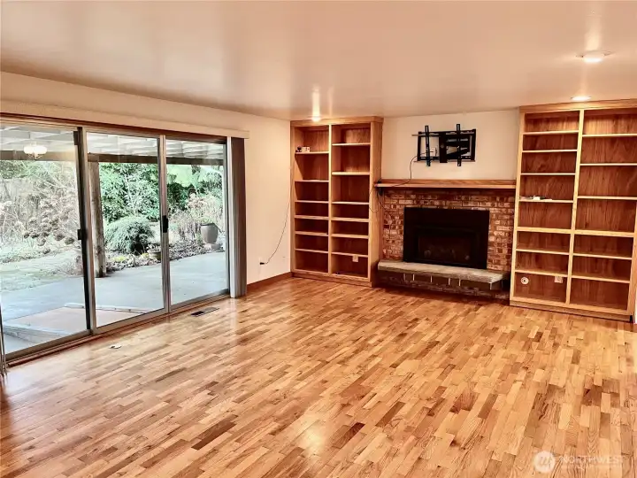 Great natural light and original hardwoods in living room that opens to large covered patio