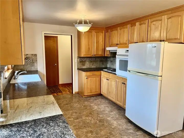 Kitchen can be  accessed from entry hall , living room, and laundry room/garage