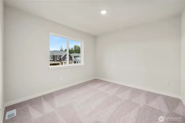 Bed 2. Photos of a previously completed home. Actual colors and finishes may vary. See site agent for details.