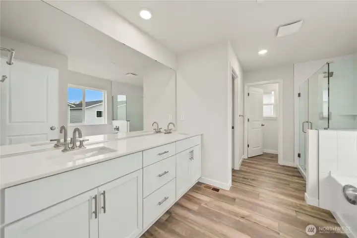 Primary bath. Photos of a previously completed home. Actual colors and finishes may vary. See site agent for details.