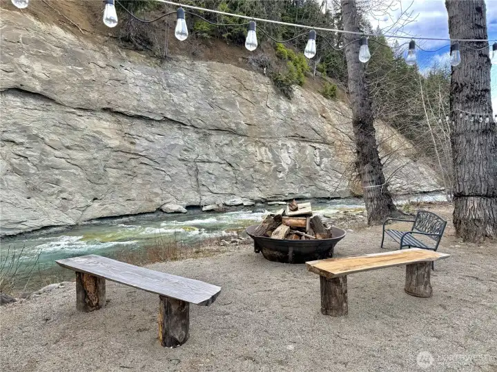 Firepit with 2 RV electrical hookups along the river.
