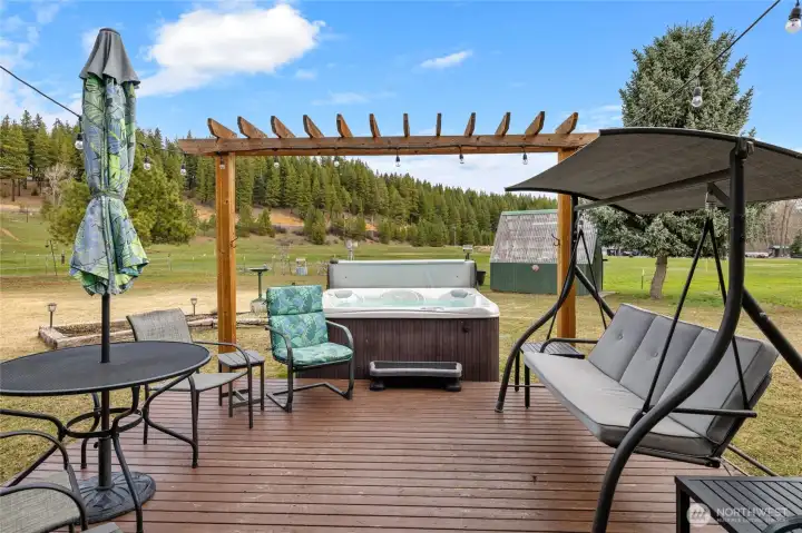 Freshly stained deck with hot tub, perfect for winding down.