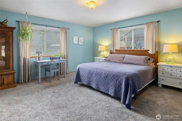 Primary bedroom on main floor with en-suite and spacious walk in closet.