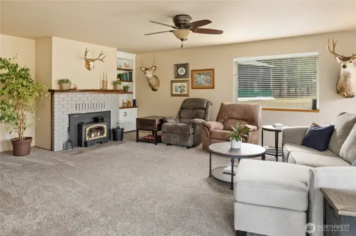 Spacious living room, with cozy fireplace.