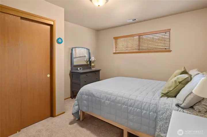 This photo showcases 1 of 2 guest bedrooms located on the second floor of the property.