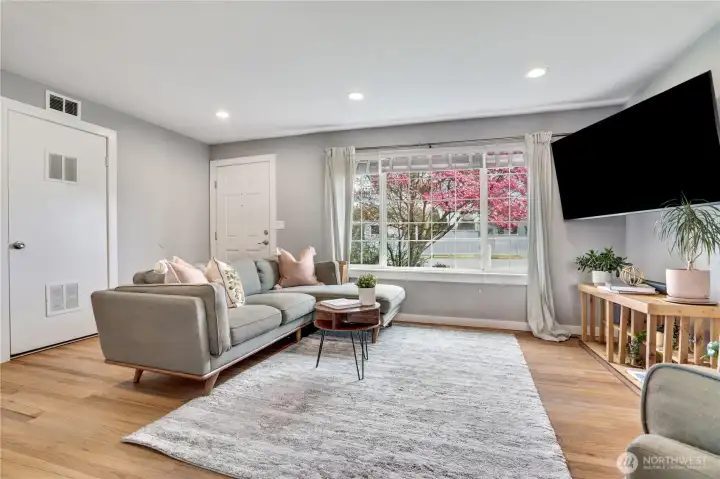 Step inside to rich hardwood floors that lead into a warm and inviting living room