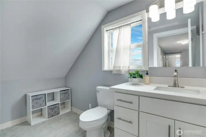 Second-floor ¾ bath with tile flooring, quartz countertops, and space to add a vanity, if desired