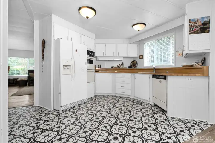 Lovely kitchen with a art deco floor adds personality to the space