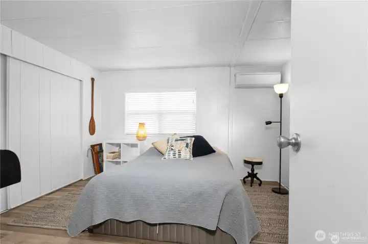 Primary bedroom has the vinyl flooring that flows through the home