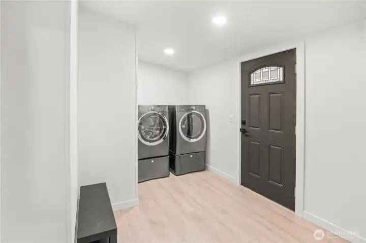 Laundry room with separate exterior entrance.