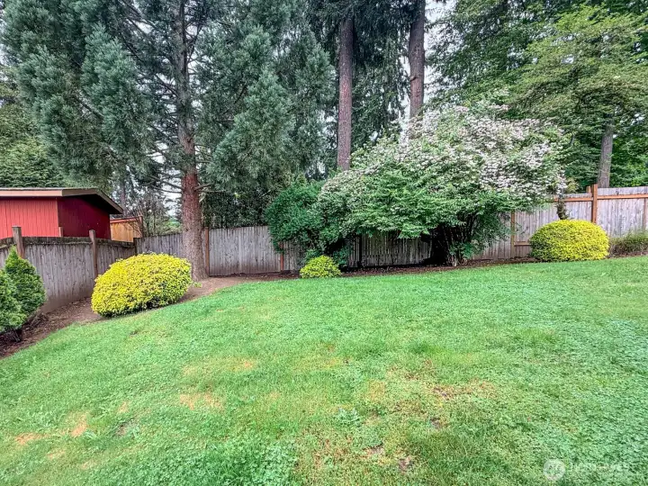 Mature landscaping with room for gardening