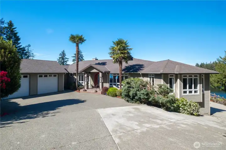 Covered entry for your guests. Both garages offer interior private entry.