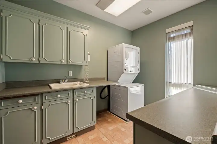 Main floor laundry room with space for 2nd refrigerator.