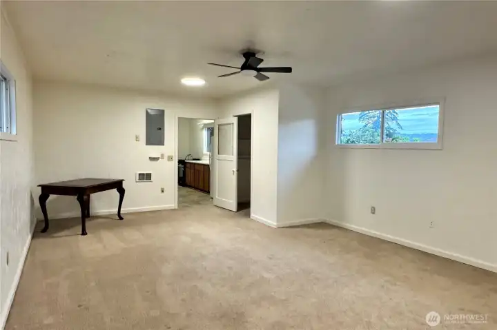 Cottage great room. The cottage is ~640 SF and has a full bath, kitchen and washer/dryer hookups.