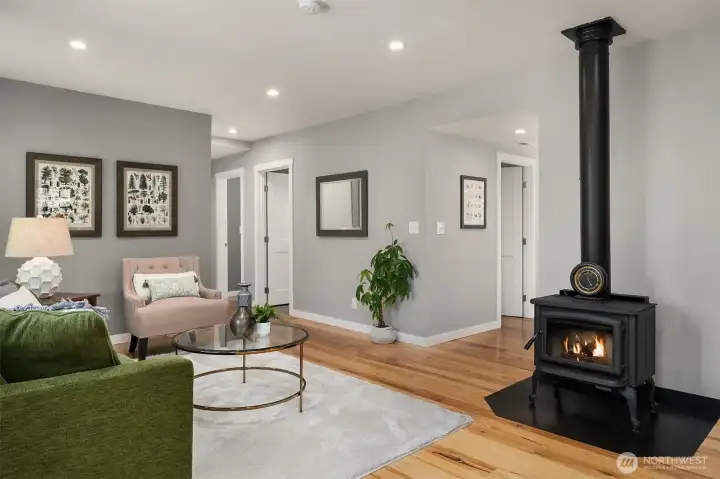 Cozy Living Room Features a Wood Burning Stove for your Ultimate Comfort!