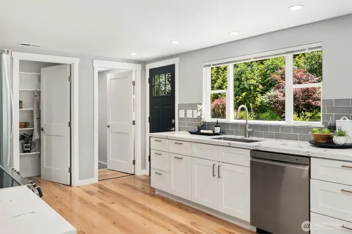 Renovated Kitchen with Walkout to Backyard Gardens - Walk-in Pantry with Custom Shelving