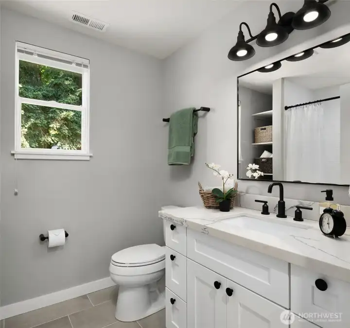 Full Bathroom with Tile Floors, Quartz Counters and Black Hardware