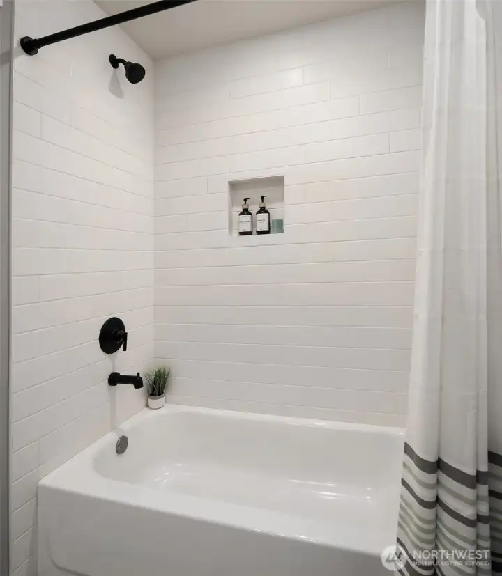 Full Bathroom with Custom Tile, Black Hardware and Black Plumbing Fixtures