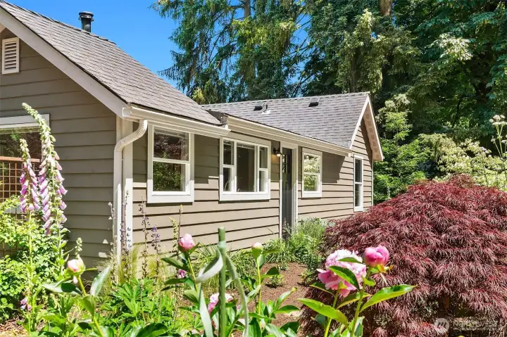 Quaint Cottage Surrounded by Beautifully Landscaped Gardens