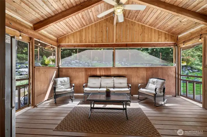 Covered and screened in back porch Covered and screened in back porch