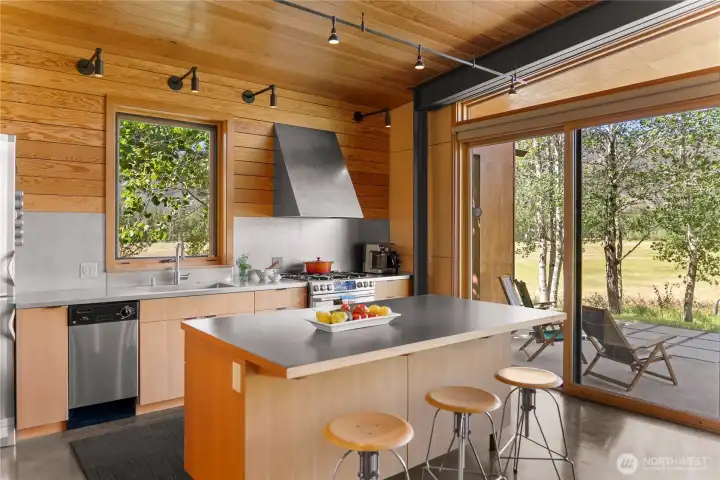 It features stainless steel countertops and appliances, lots of cabinetry, deep drawer storage and a walk-in pantry. It features stainless steel countertops and appliances, lots of cabinetry, deep drawer storage and a walk-in pantry.