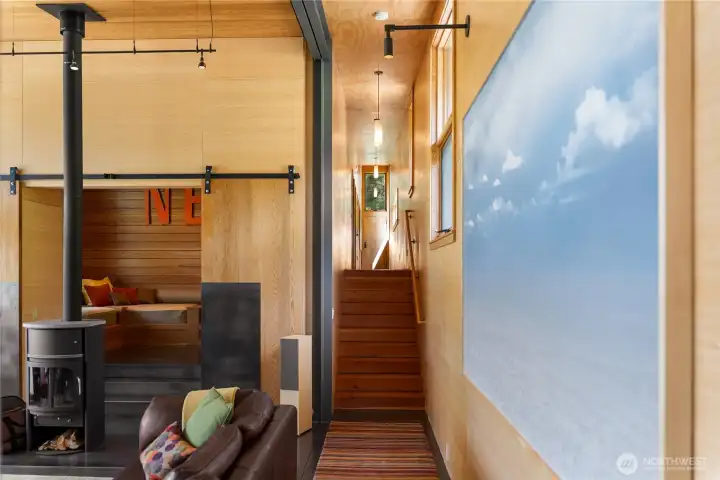 Stairs with large timber treads lead to the 2 primary bedroom suites. Stairs with large timber treads lead to the 2 primary bedroom suites.
