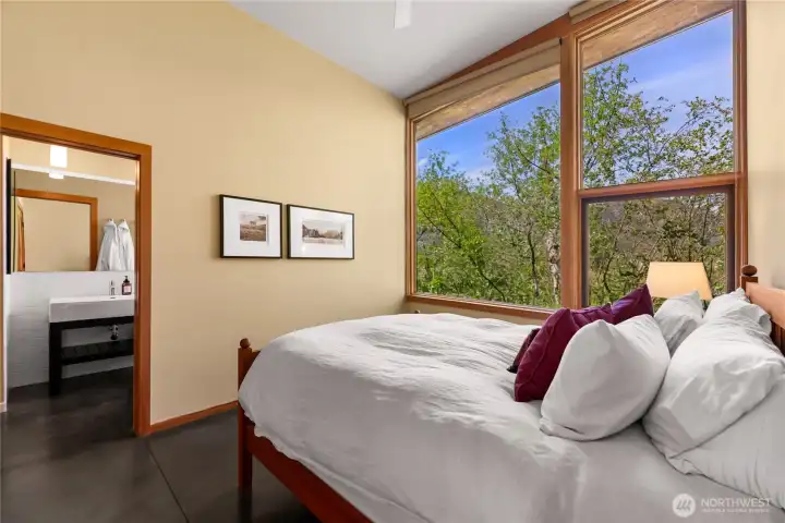 The bedrooms offer peekaboo views of the meadow and more intimate views of the home's native landscaping. The bedrooms offer peekaboo views of the meadow and more intimate views of the home's native landscaping.