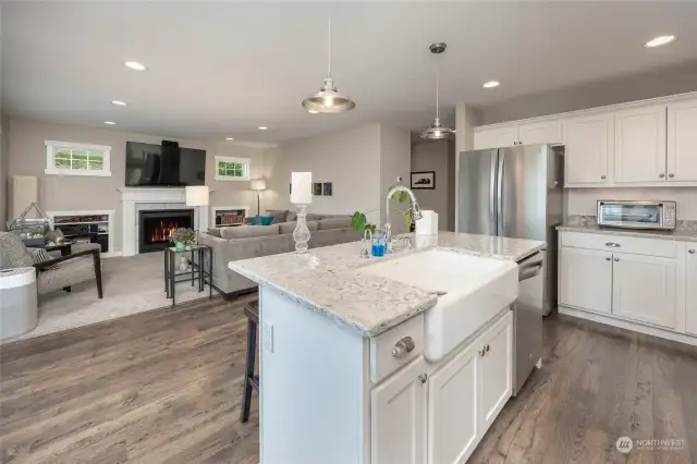 Sunny remodeled kitchen with adjacent family room with gas fireplace.
