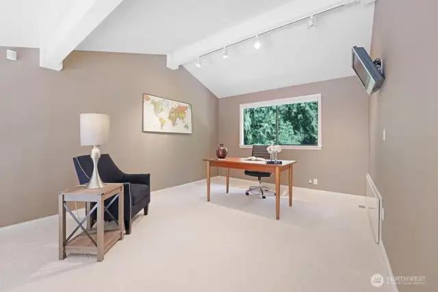 Lofted den with custom railing above the Living and dining rooms