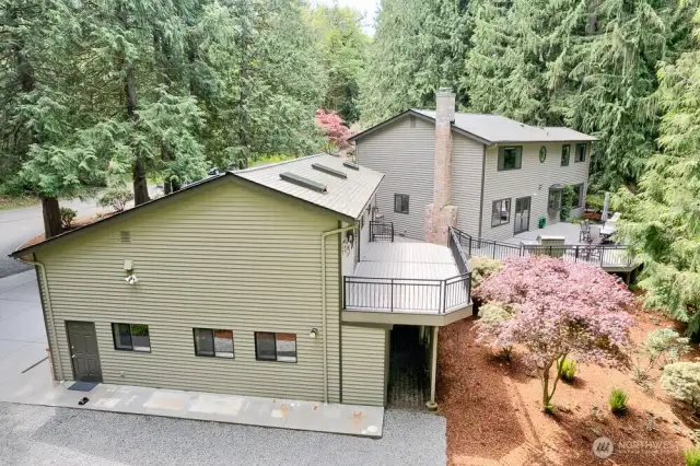Side view of home and detached game room/3 car garage