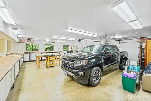 Detached 3 car garage with heated shop below the game room. Look at all the cabinet and counter space!