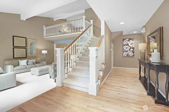 Front entry - custom railing, and oak hardwood floors
