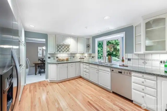 Custom kitchen with custom cabinets, tiled counters and more