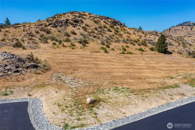 Lot 5 has a slight slope providing extra elevation to optimize view of Wapato Lake. Plenty of space to spread out but not too much to maintain.